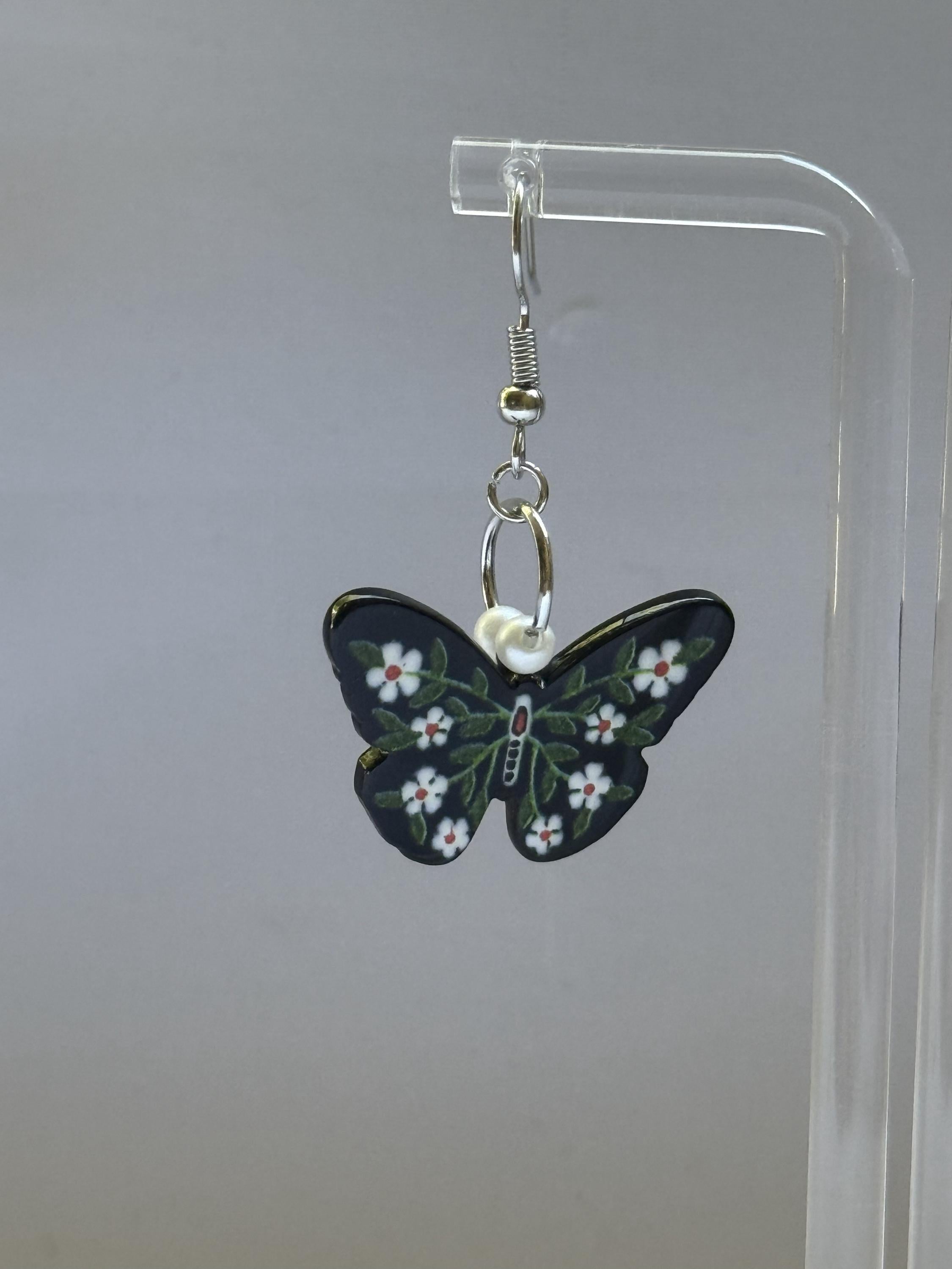 Dark Garden Earrings – Butterfly Dangles with White Flowers & Green Leaves