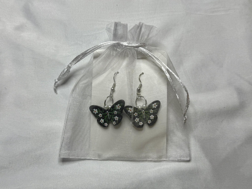 Dark Garden Earrings – Butterfly Dangles with White Flowers & Green Leaves