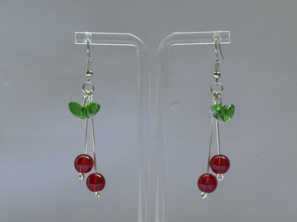 Cherry Drop Earrings – Handmade Red Bead Dangles with Green Leaf Accent & Silver Hooks