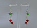 Cherry Drop Earrings – Handmade Red Bead Dangles with Green Leaf Accent & Silver Hooks