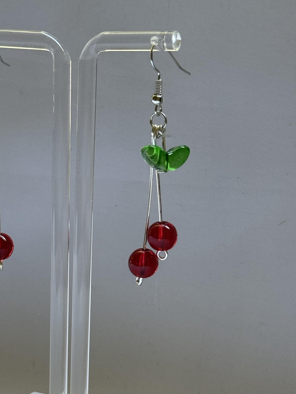 Cherry Drop Earrings – Handmade Red Bead Dangles with Green Leaf Accent & Silver Hooks